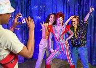 The images shown depict wax figures created and owned by Madame Tussauds.