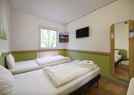 IBIS Budget Köln Messe, Zimmerbeispiel, Modernes, helles Zimmer im IBIS Budget Köln Messe Hotel., Modernes Zimmer im IBIS Budget Köln Messe mit zwei Betten.