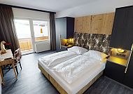 Hotel Panther´A, Zimmerbeispiel, Modernes Hotelzimmer mit gemütlichem Doppelbett im Hotel Panther´A.