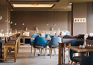 Modernes Hotelrestaurant mit stilvollem, gemütlichem Ambiente., Modernes, gemütliches Hotelrestaurant mit stilvollem Ambiente.