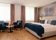 Art Hotel Aachen, Zimmerbeispiel, Modernes Hotelzimmer im Art Hotel Aachen mit stilvollem Design.