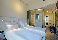 Mercure Zürich City, Zimmerbeispiel, Modernes Hotelzimmer im Mercure Zürich City, stilvoll und einladend.